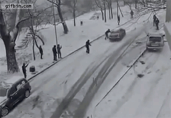 1358273993_superman_stops_car_from_sliding_into_another_car